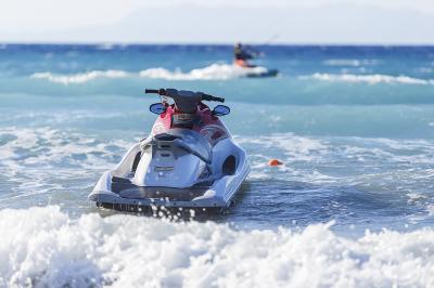 Blue sea and a jet ski floating on the ,
