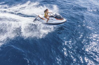 Aerial view of jet skier in blue sea. Jet ski in turquoise clear water racing stock photo