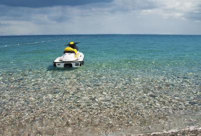 The jet ski parked on beautiful beach.