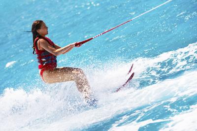 Attractive young woman water skiing
