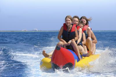 People ride on banana boat