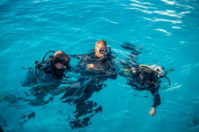 Diving instructor and his students. Diving in Egypt. Active holidays on the Red Sea coast
